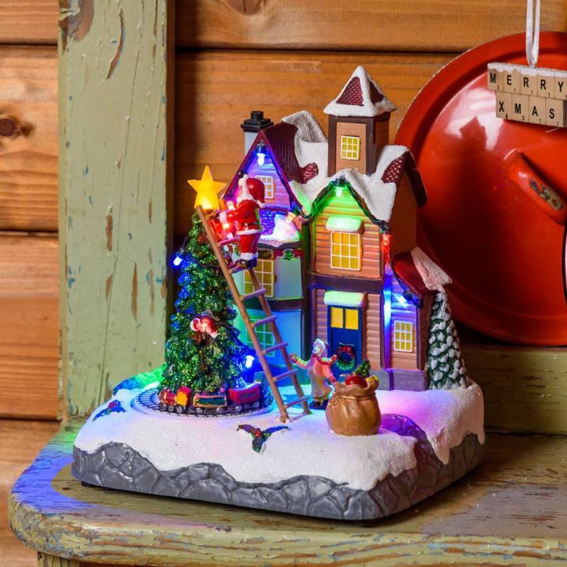 Lotti - Village de noël lumineux animé Père Noël sur échelle et Petit Train Tournant LED Musique Lotti - Image 9