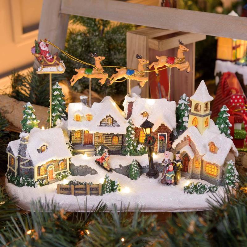 Lotti - Village de Noël LED Enneigé avec Eglise Père Noël sur Traineau Volant avec Rennes en Mouvement et Musique Lotti - Image 1
