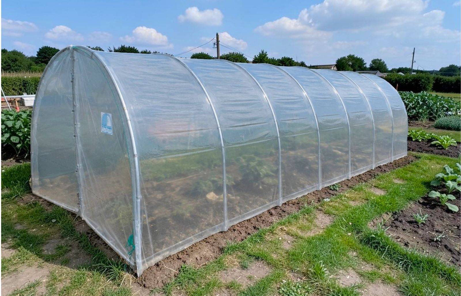 Serre tunnel de jardin - 31,5m² - 3 x 10,5 m - pieds arrondis - polyéthylène haute densité - 2 portes pivotantes - LES SERRES TONNEAU - Image 1