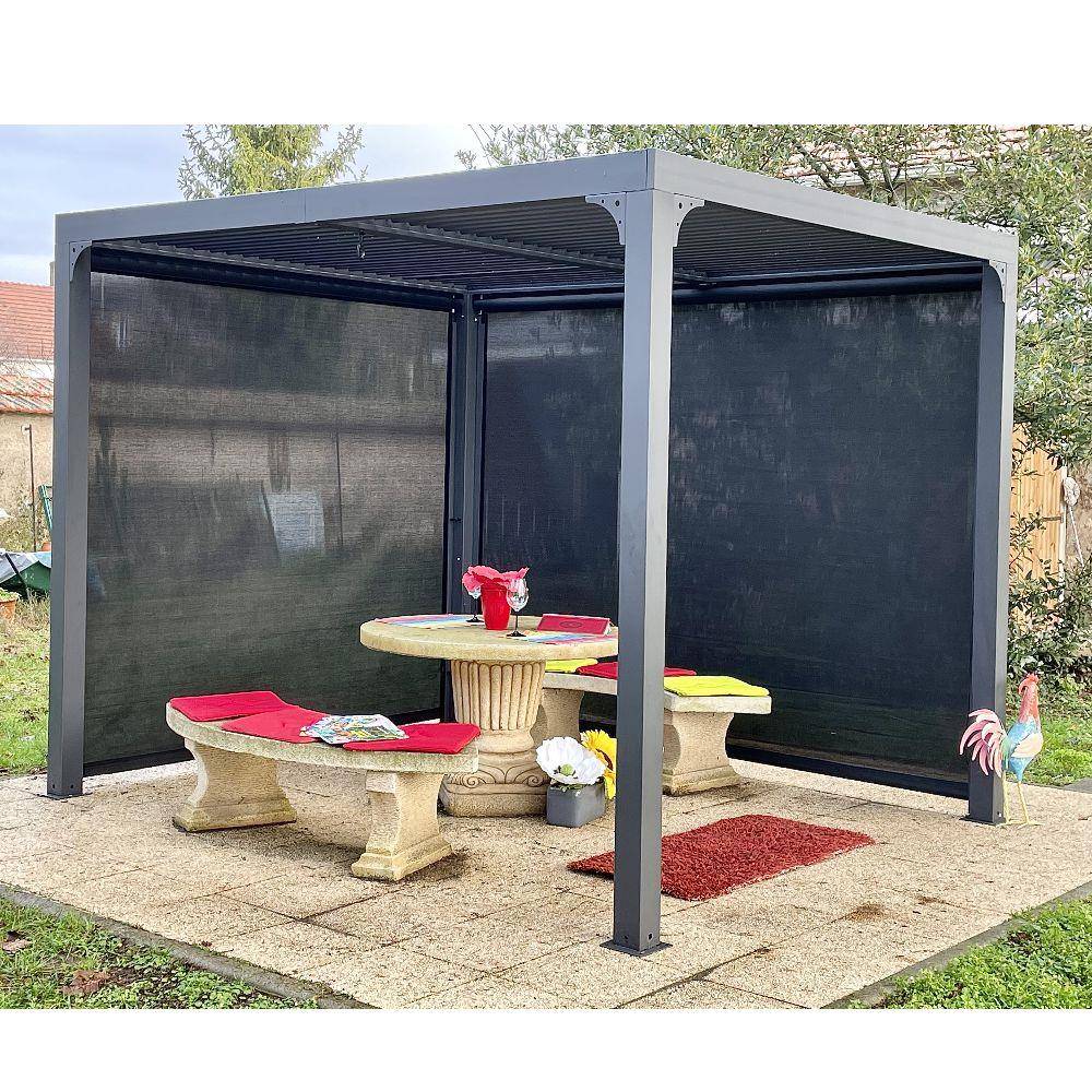 Pergola autoportante bioclim. en alu. avec rideau manuel 7m2